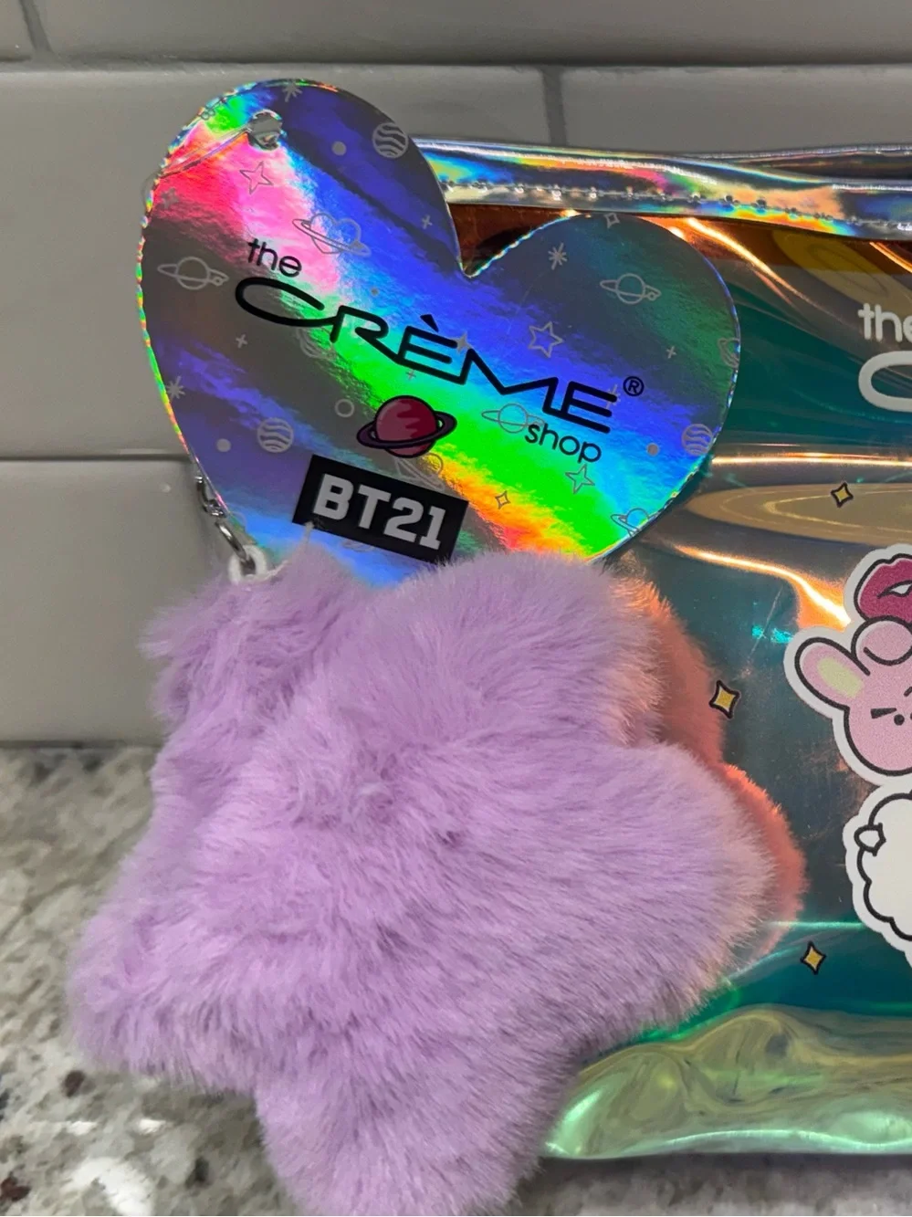 Crème Shop holographic BT21 pouch with purple fuzzy star charm NWT